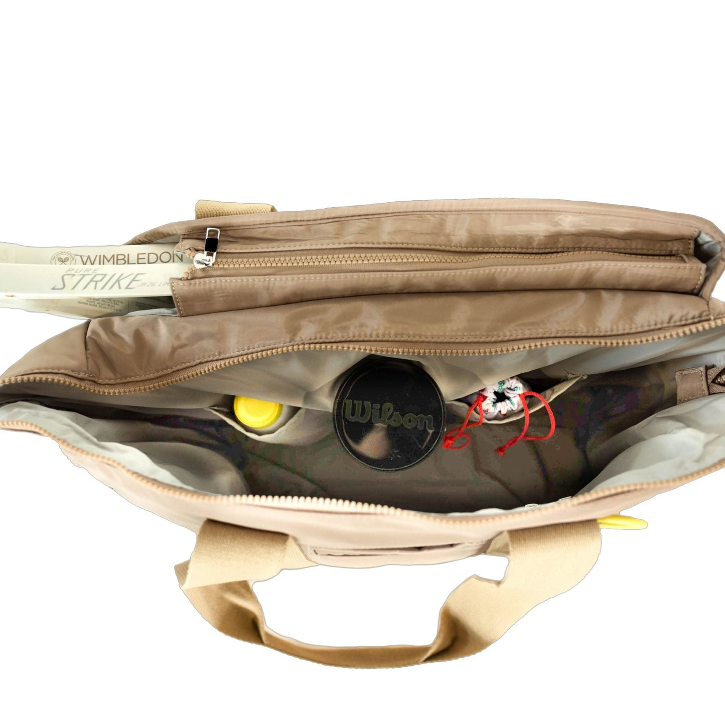 Open beige bag with tennis racket and equipment on a white background