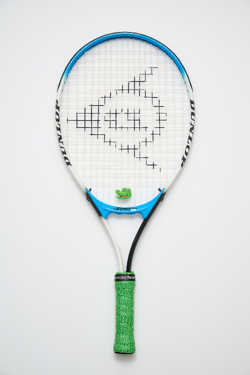Tennis racket with a white strings pattern on a light gray background