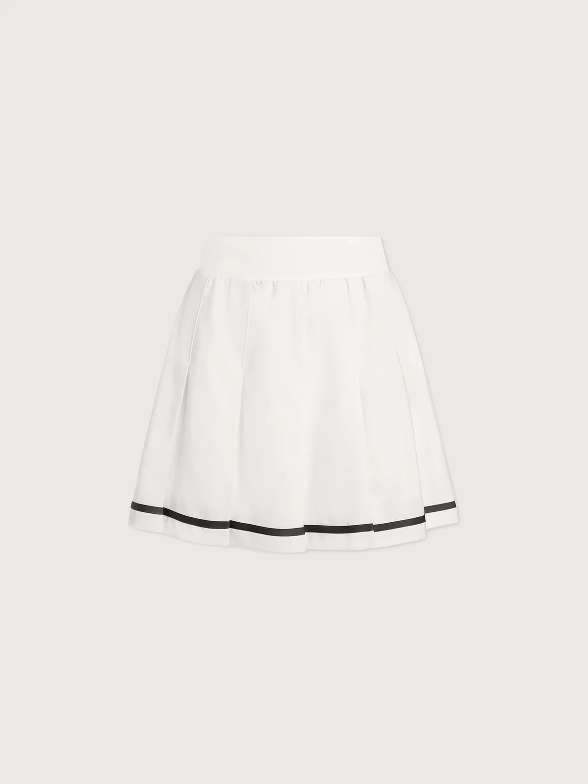 Varley white skirt with navy blue trim on a light gray background on tennisdujour.com