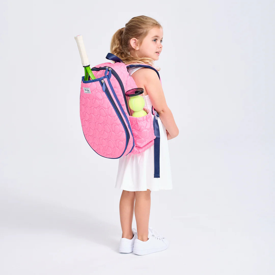 Girl carrying Ame & Lulu Pink tennis backpack for kids on TennisDuJour.com