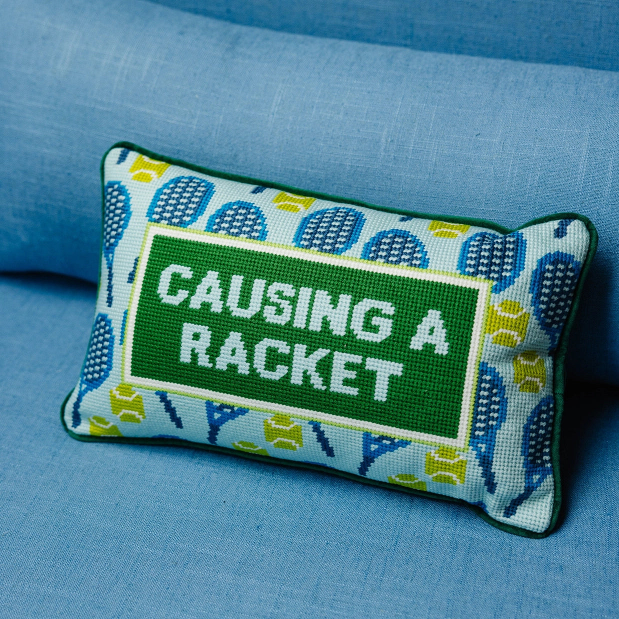 Furbish Causing a Racket Tennis Pillow on TennisDuJour.com