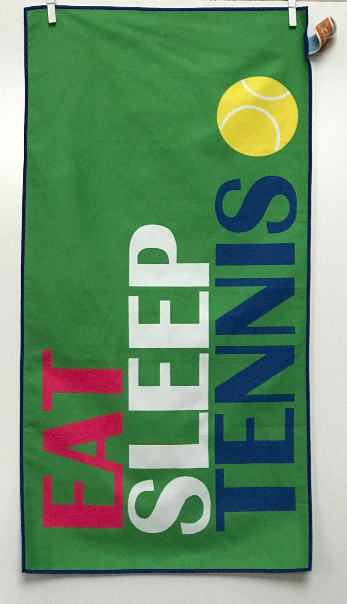 Towel with 'Eat Sleep Tennis' text and a tennis ball graphic on a green background