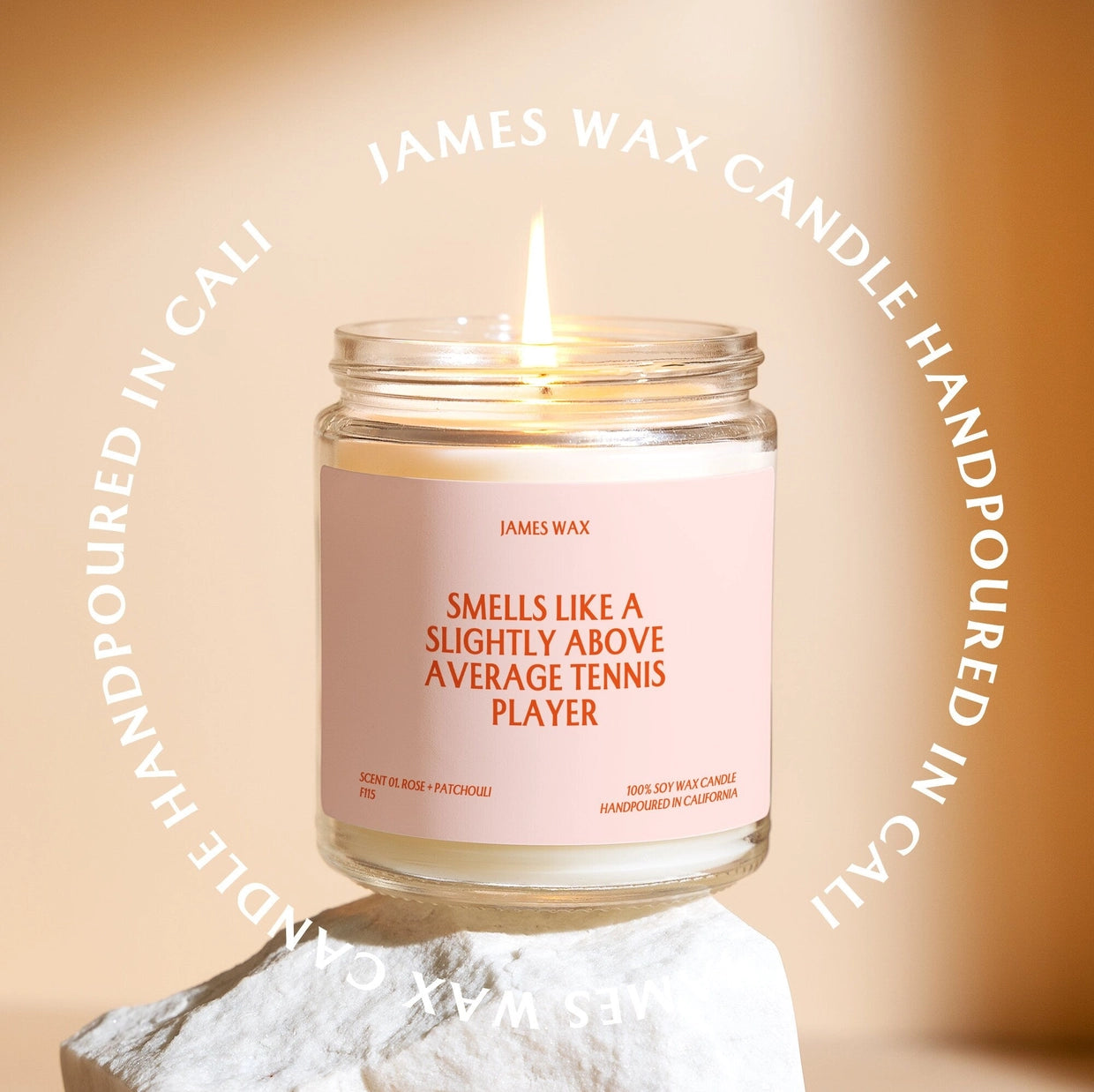 Candle "Smells Like a slightly above average tennis player" on the label.