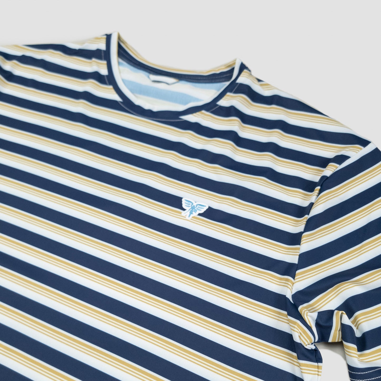 Sigrún men's striped match tee logo view.