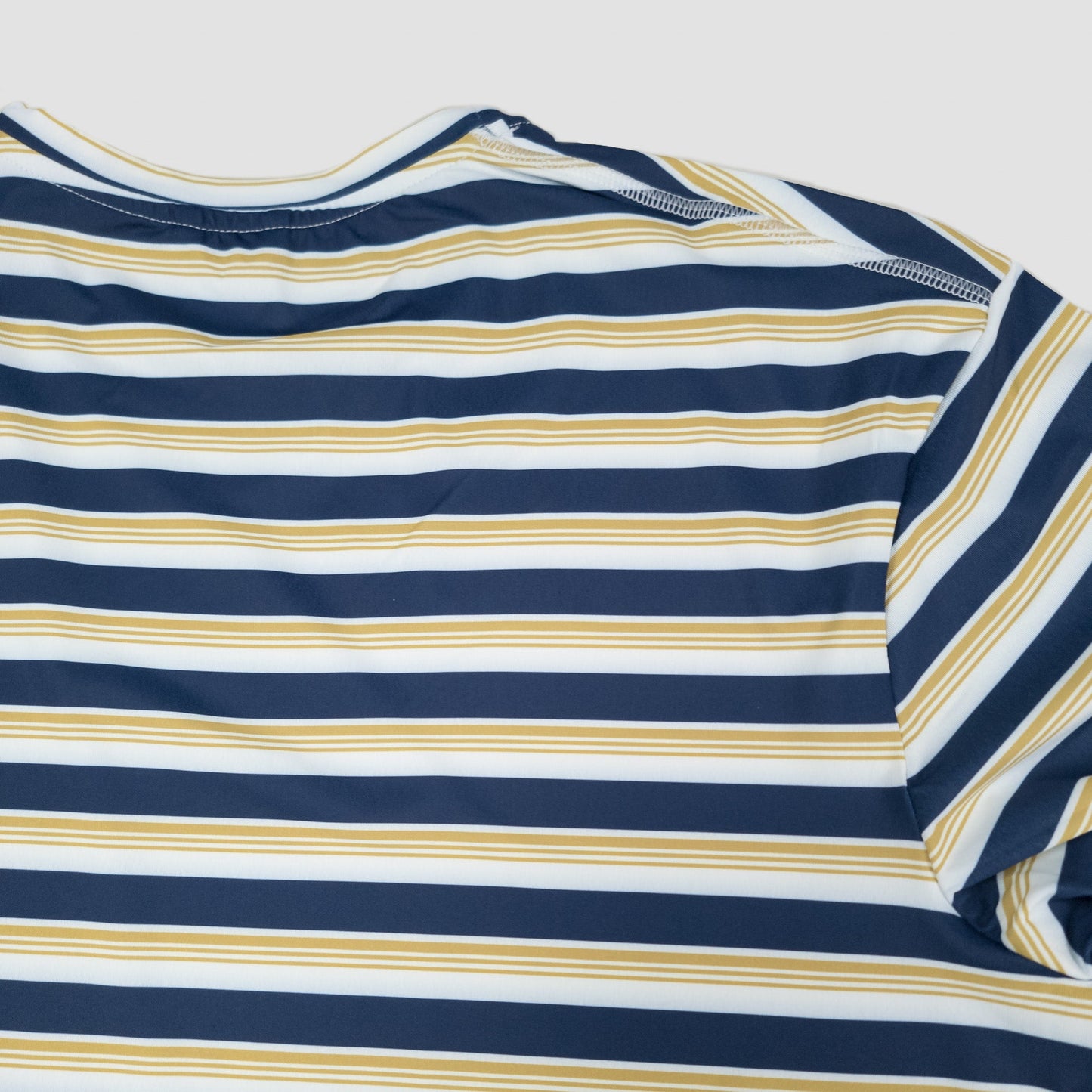 Sigrún men's striped match tee back neck view.