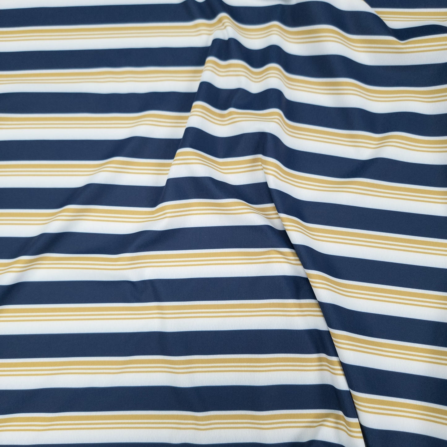 Sigrún men's striped match tee close up view.
