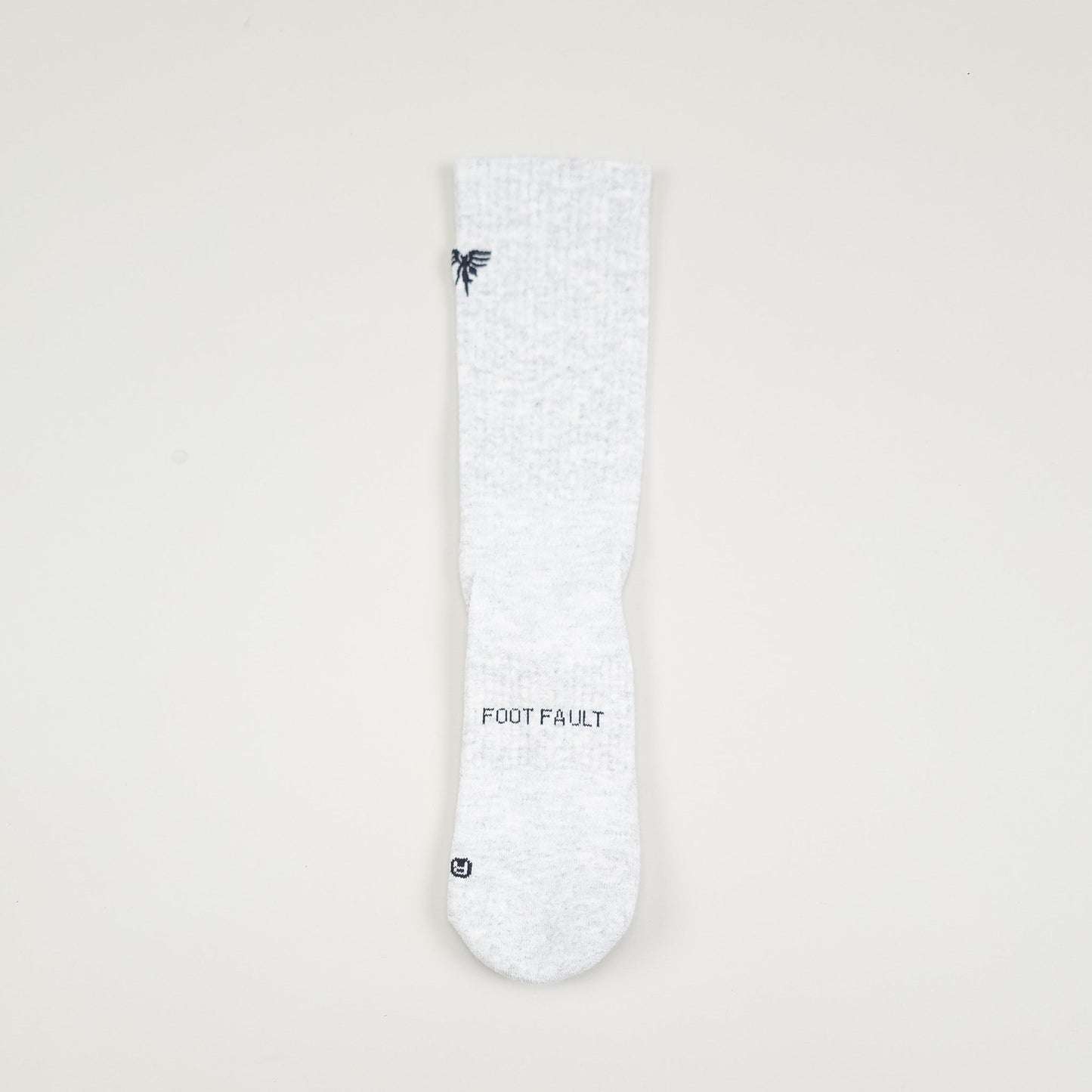 Sigrún tennis socks with foot fault written on them.