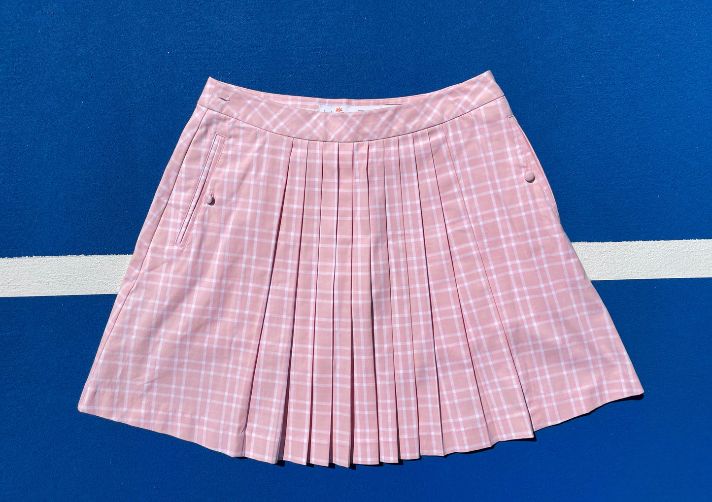 Lily's of Beverly Hills pink plaid skirt on a blue background