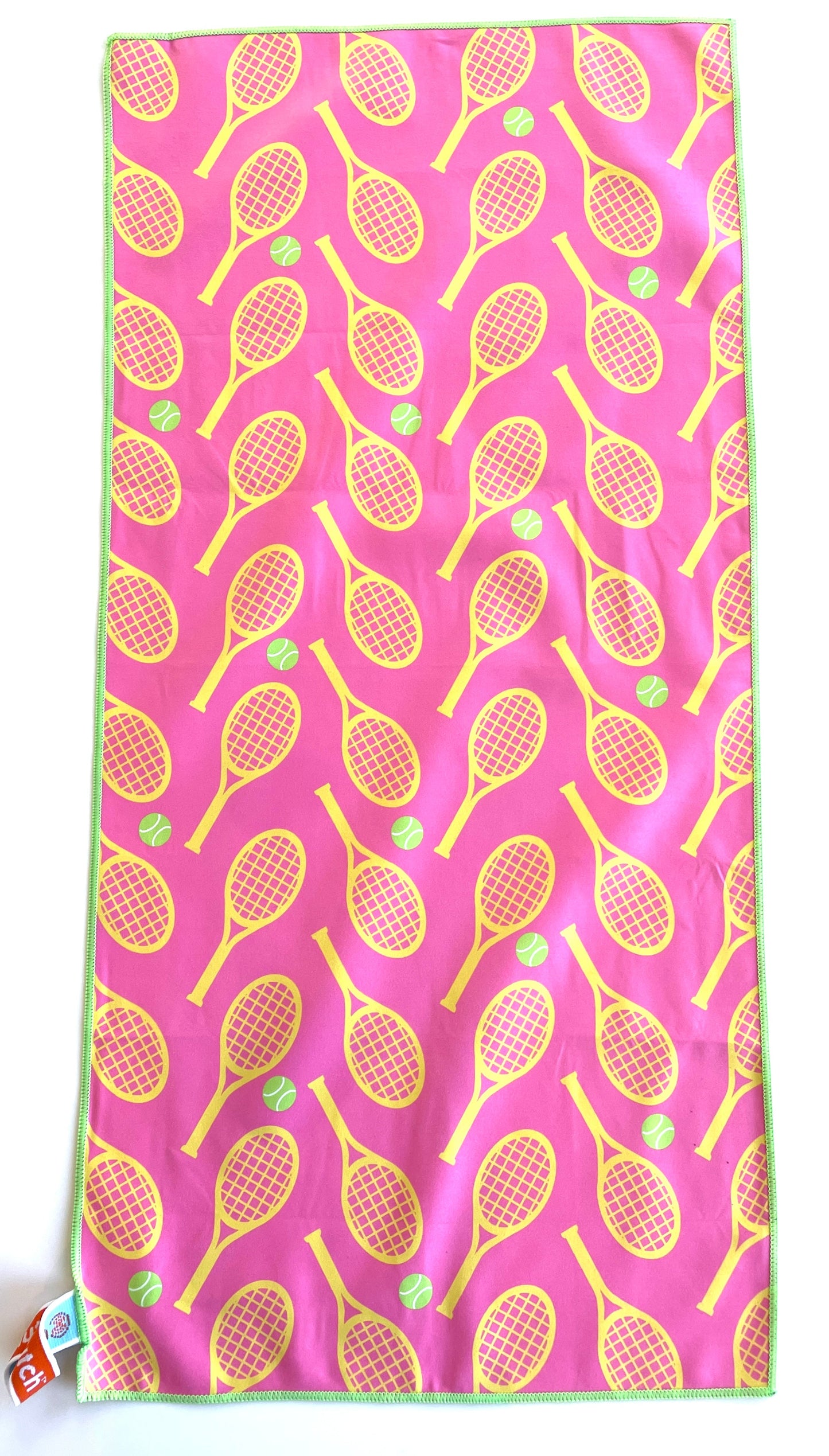 Towel with tennis racket pattern on a pink background