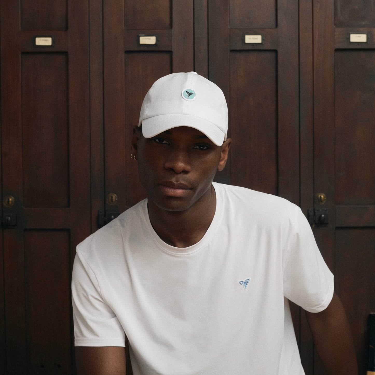 Model wearing Sigrún match tee in white and Sigrún match hat.