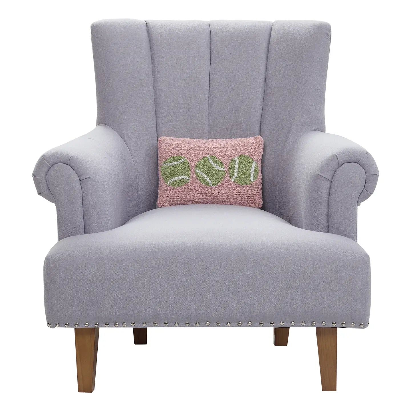 Tennis Balls Hook Throw Pillow shown in a chair on TennisDuJour.com