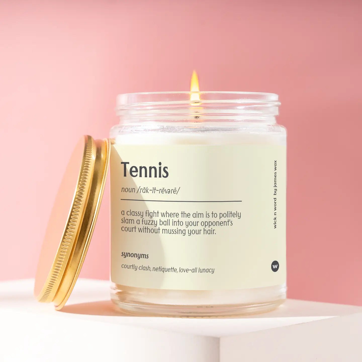 Glass jar candle with Tennis definition on Tennis DuJour.