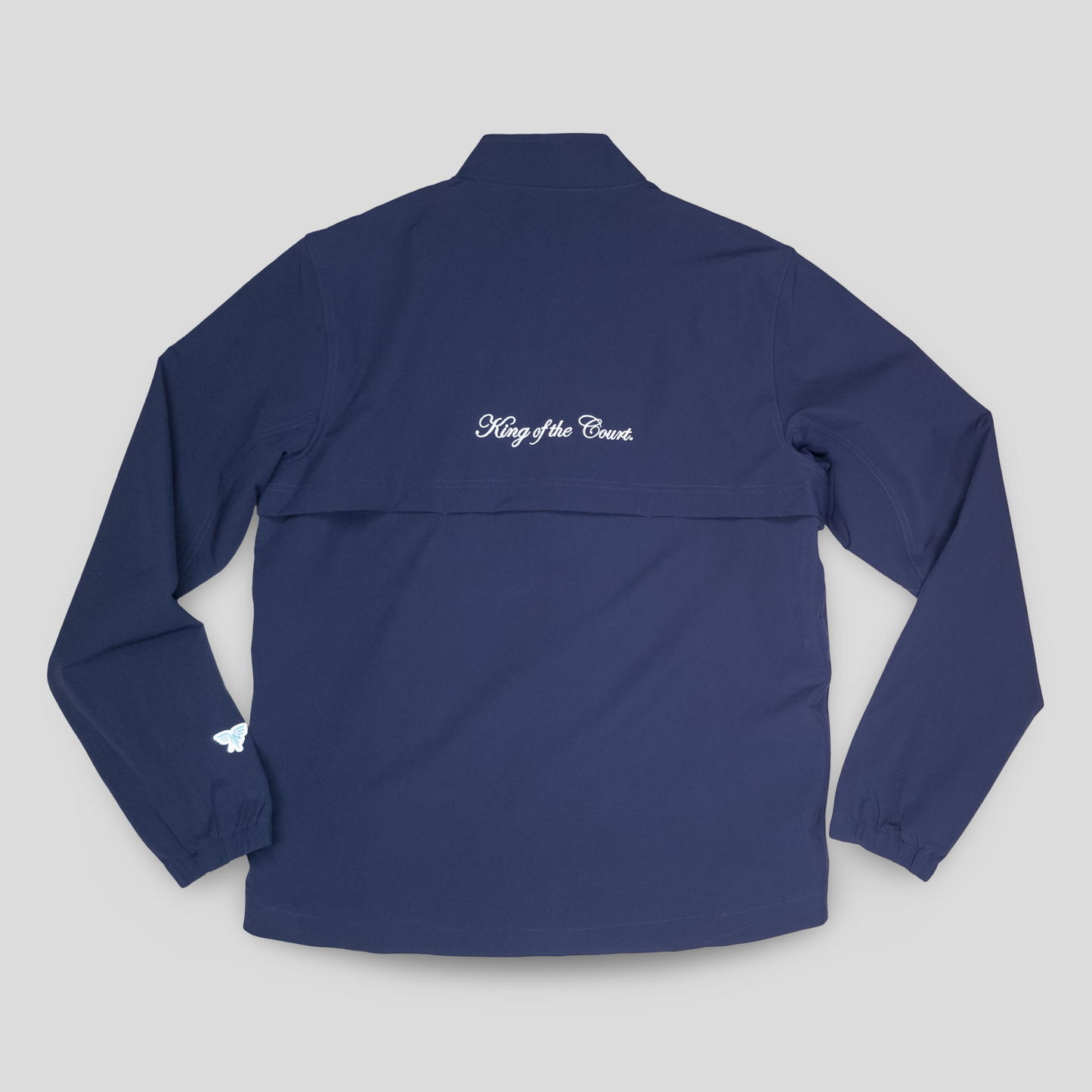Sigrún match tennis jacket in navy back view.