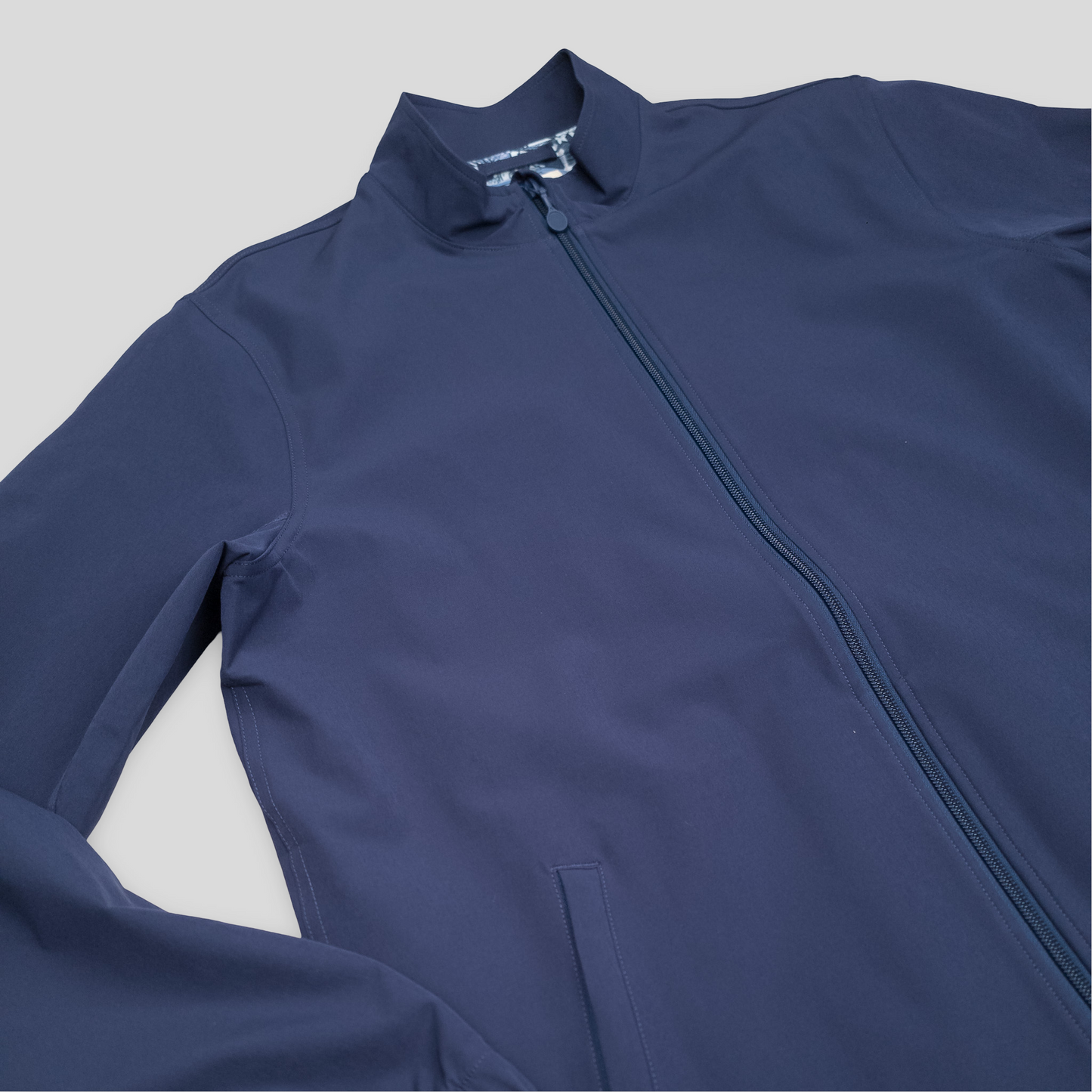 Sigrún navy tennis jacket.