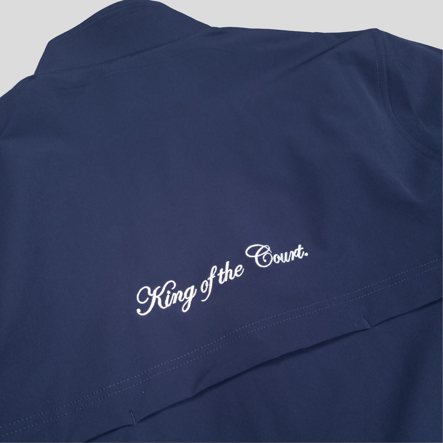 Sigrún navy match tennis jacket back view.