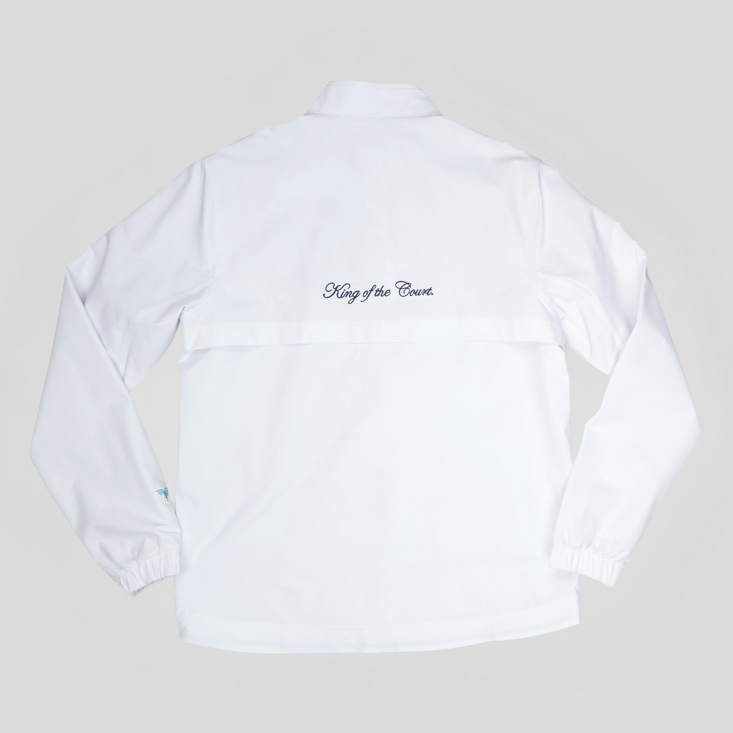 Sigrún match tennis jacket in white with king of the court written on the back.