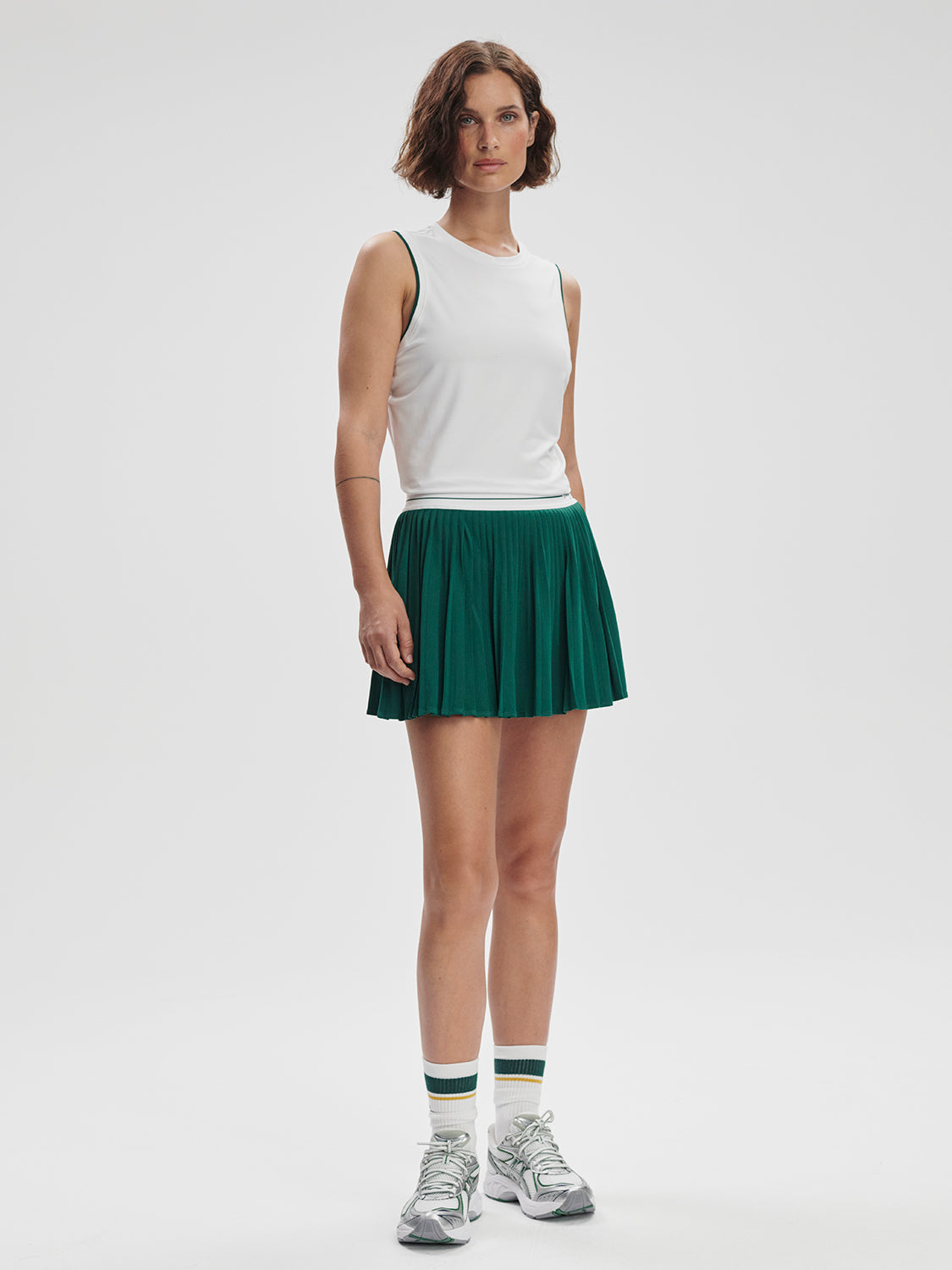 Model wearing Varley Arton Performance Tank in white on TennisDuJour.com.