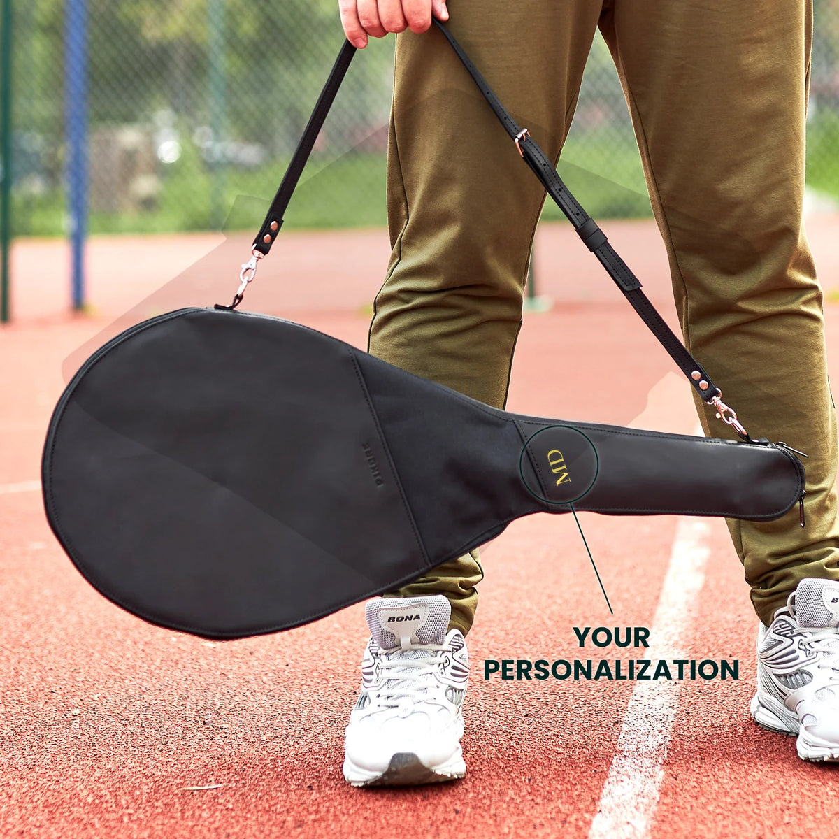 Genuine leather tennis racquet bag in black.