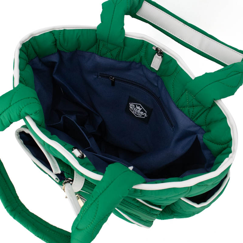 Green bag with a navy interior and visible brand logo on a white background