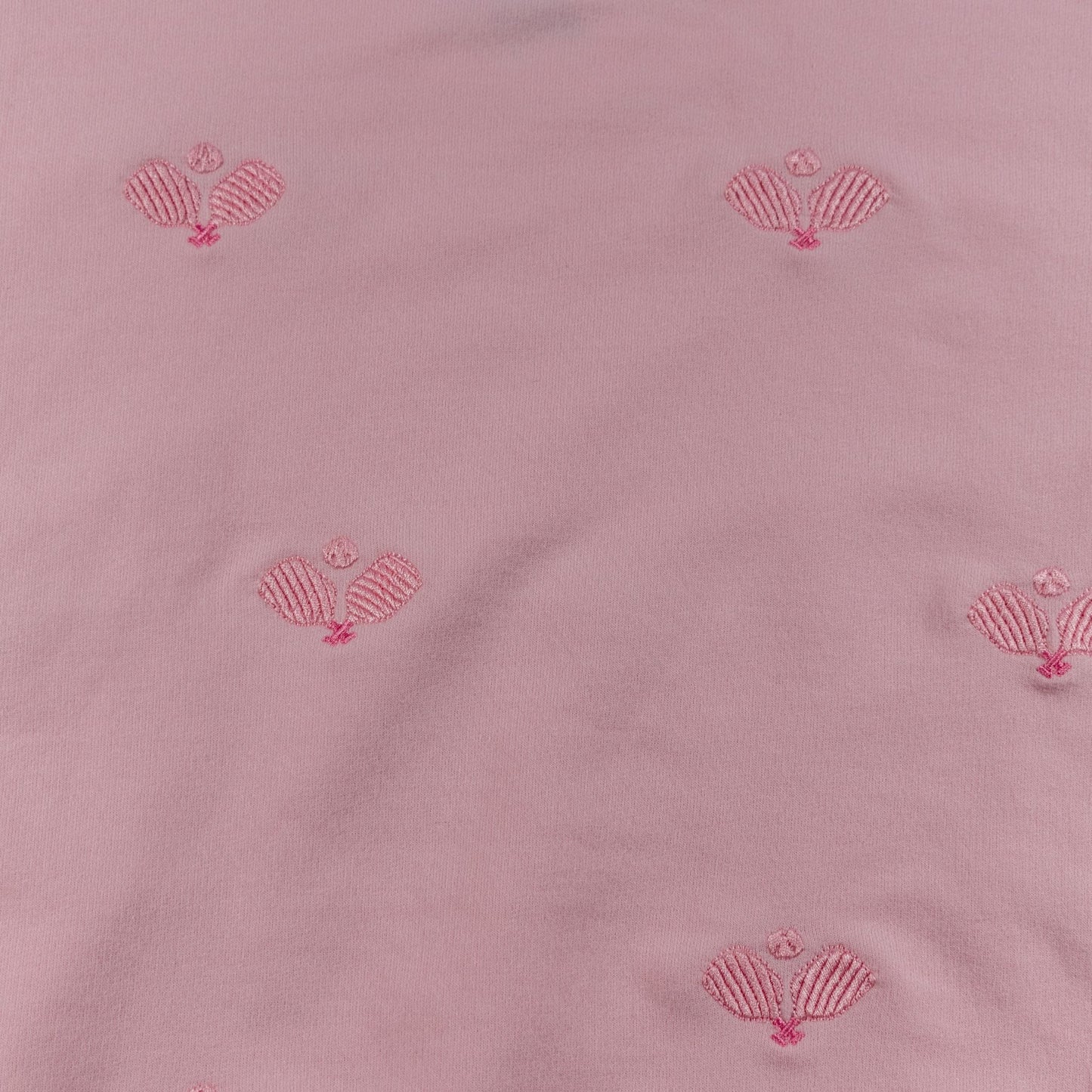 Pink fabric with red shell patterns