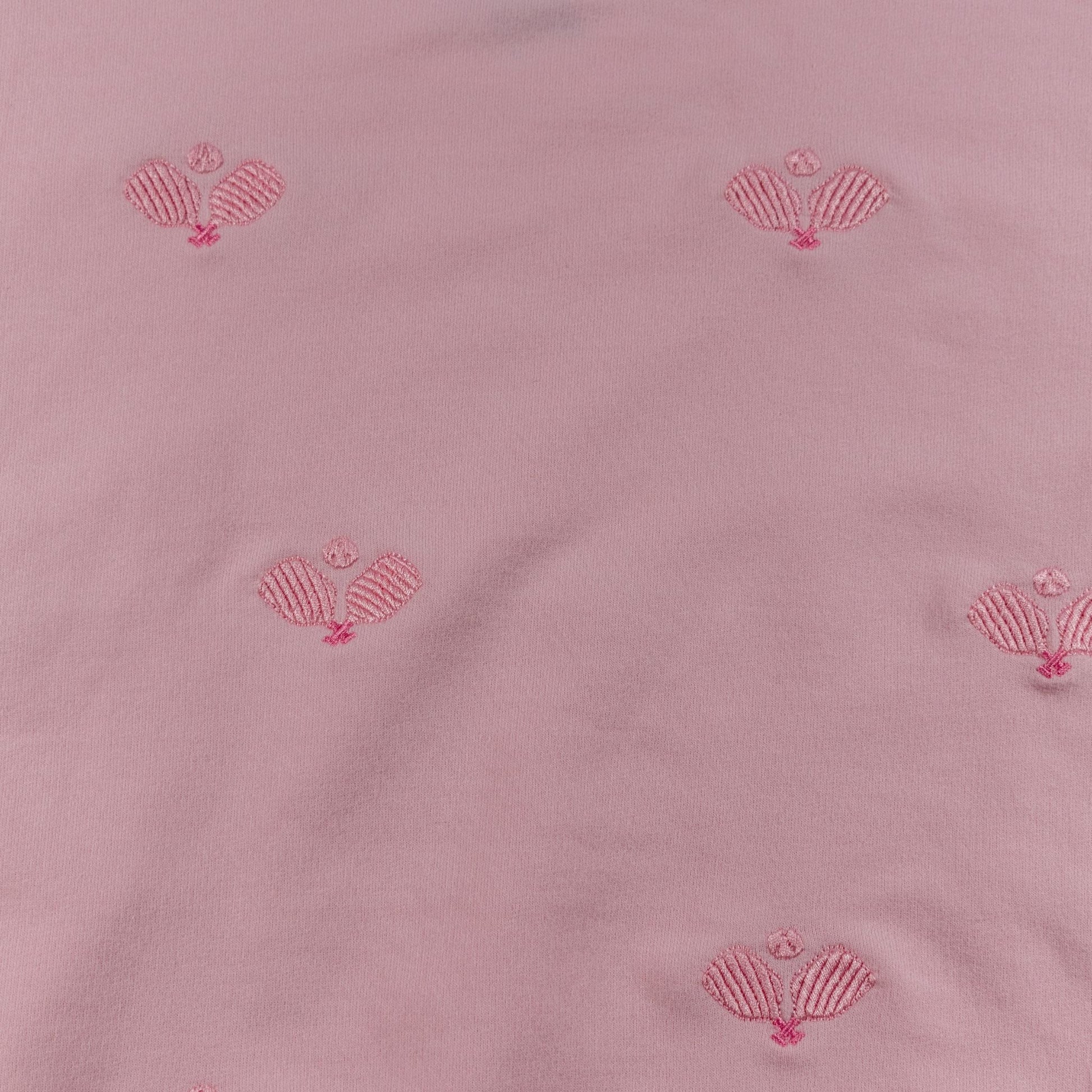 Pink fabric with red shell patterns