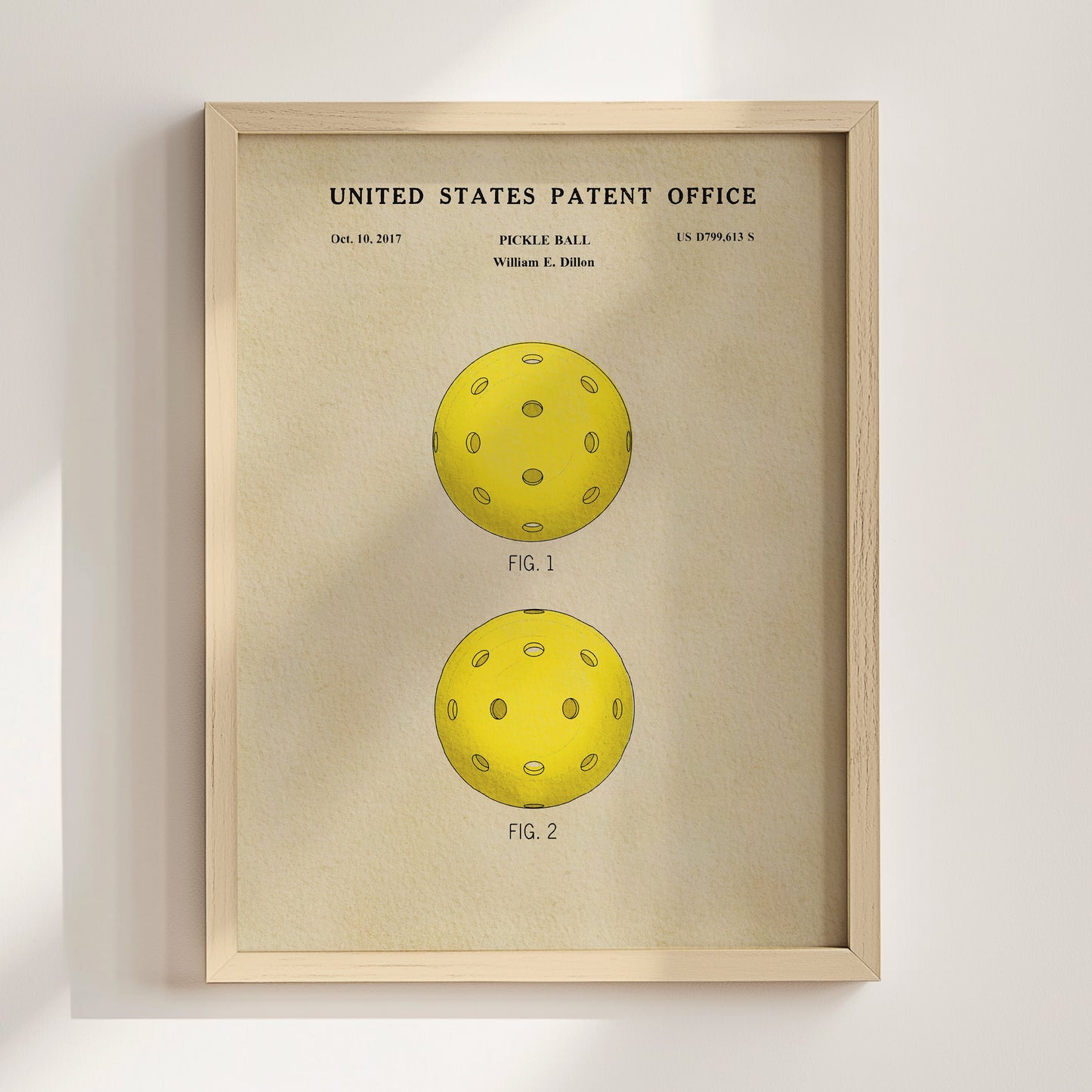 Framed poster of a pickle ball design from the United States Patent Office on a beige background.