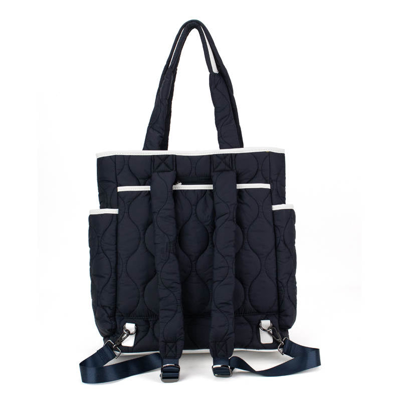 Black quilted pickleball backpack with multiple pockets on a white background