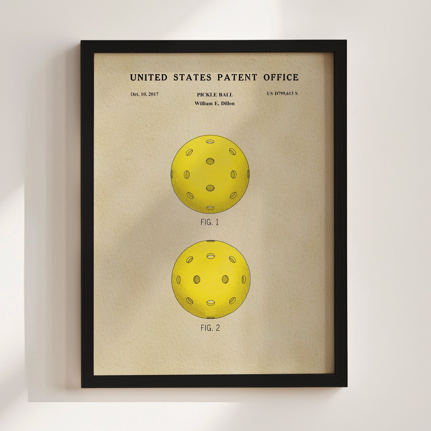 Framed poster of a pickle ball design with 'United States Patent Office' text on a beige background.