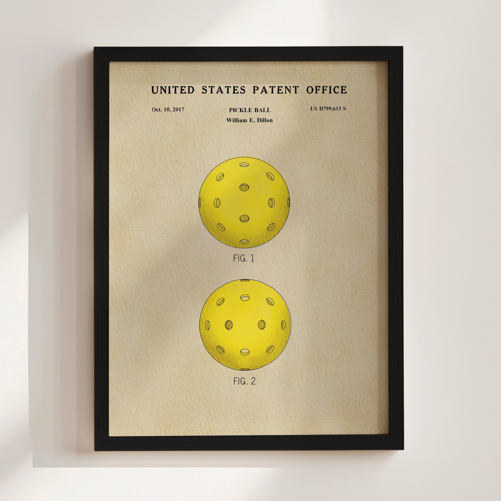 Framed poster of a pickle ball design with 'United States Patent Office' text on a beige background.