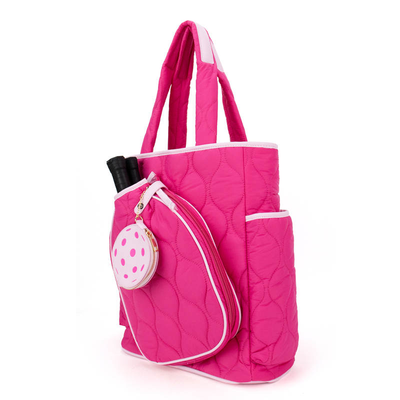 Pink quilted pickleball tote bag with a small round pouch on a white background