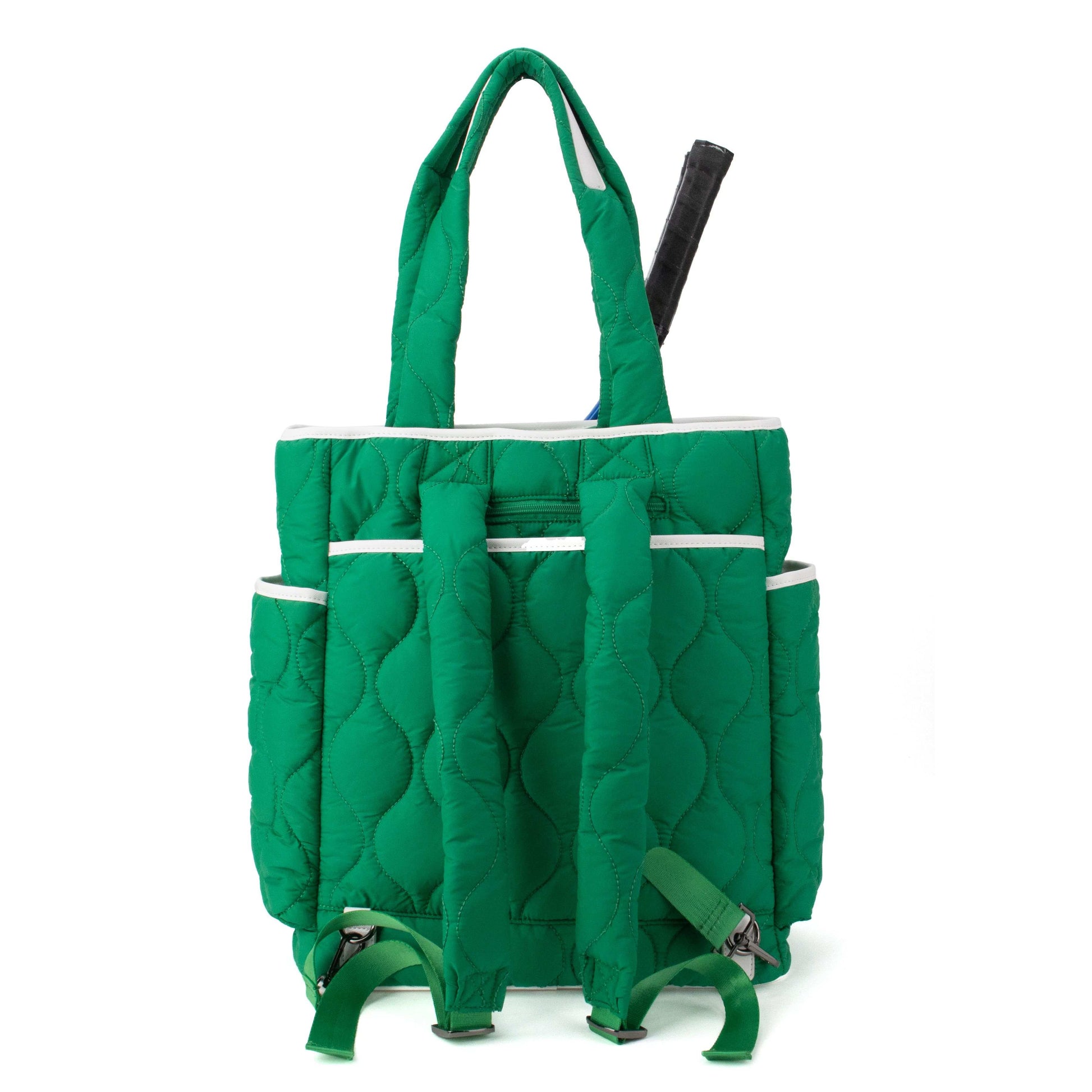 Green quilted bag with multiple compartments on a white background