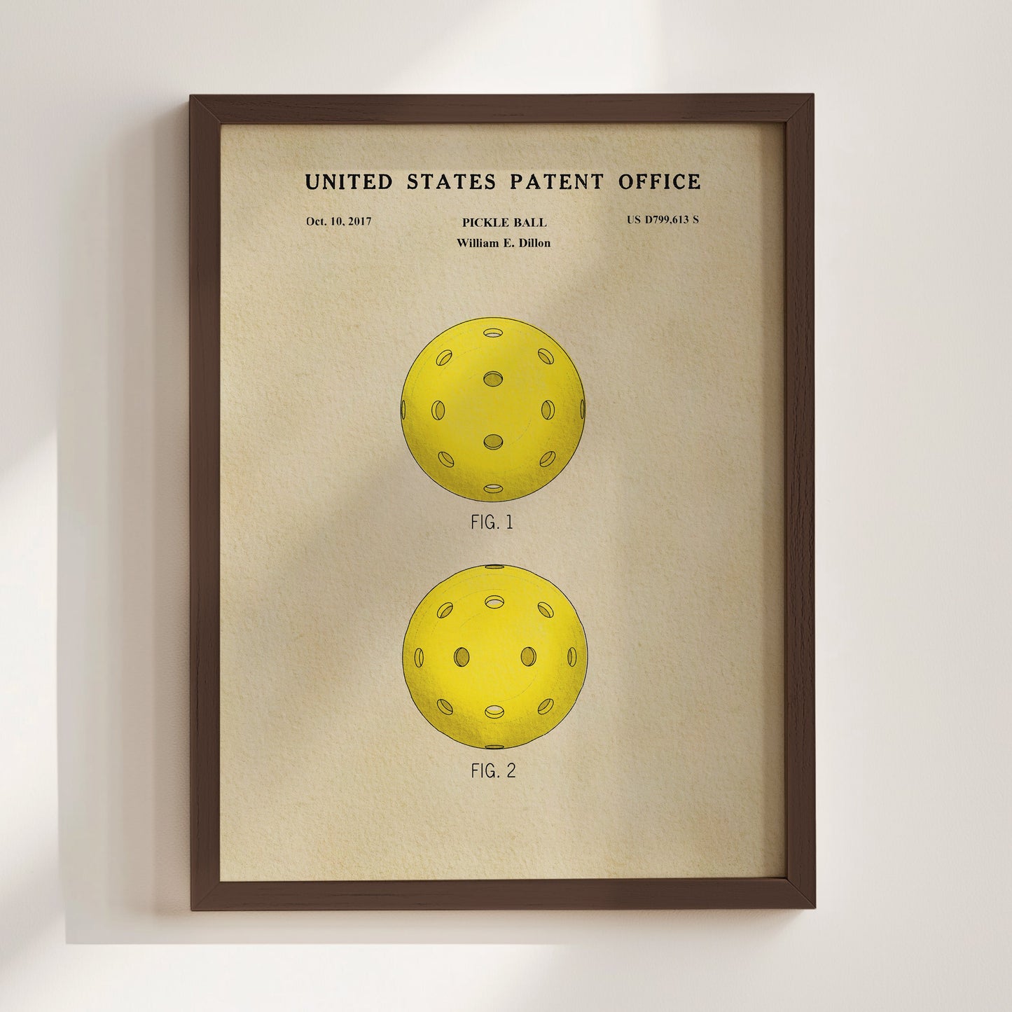 Framed poster of a pickle ball design from the United States Patent Office on a beige background.