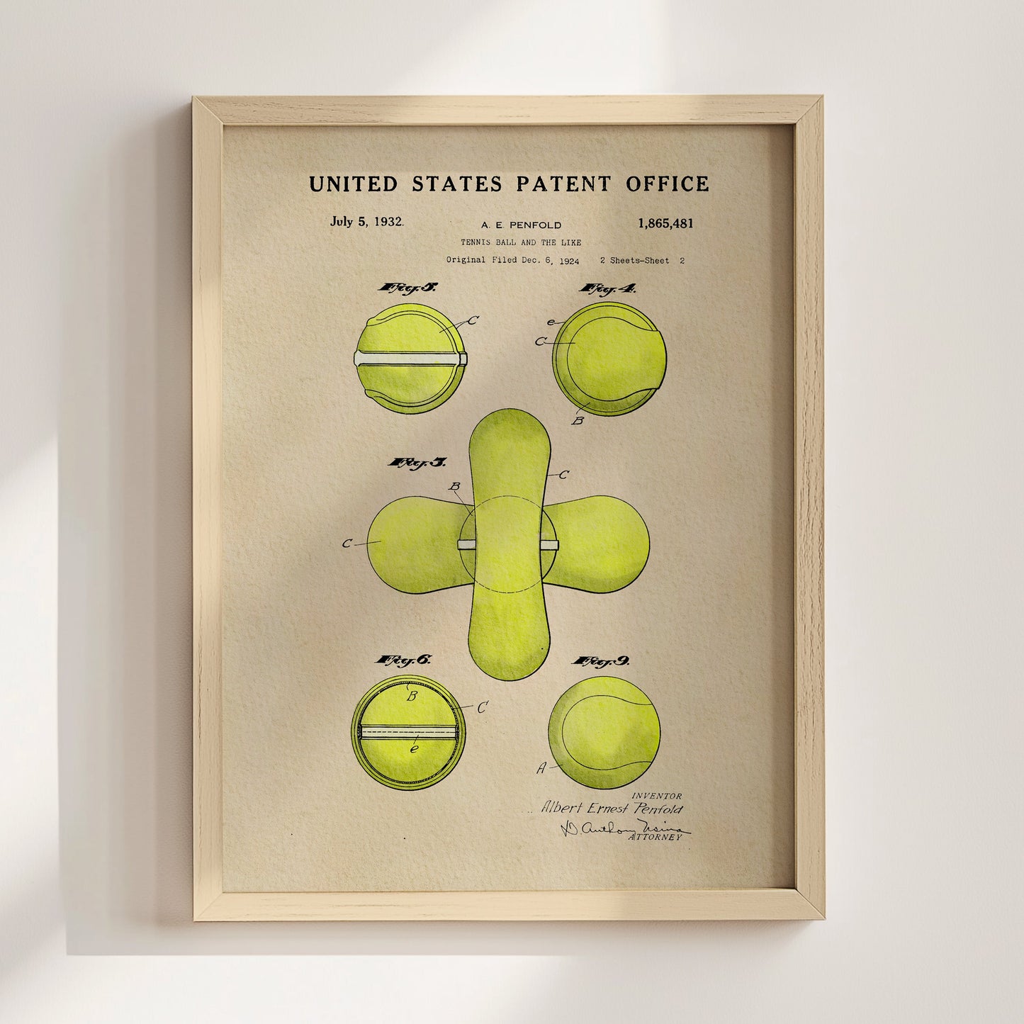 Framed patent poster of a tennis ball design with green illustrations on beige background