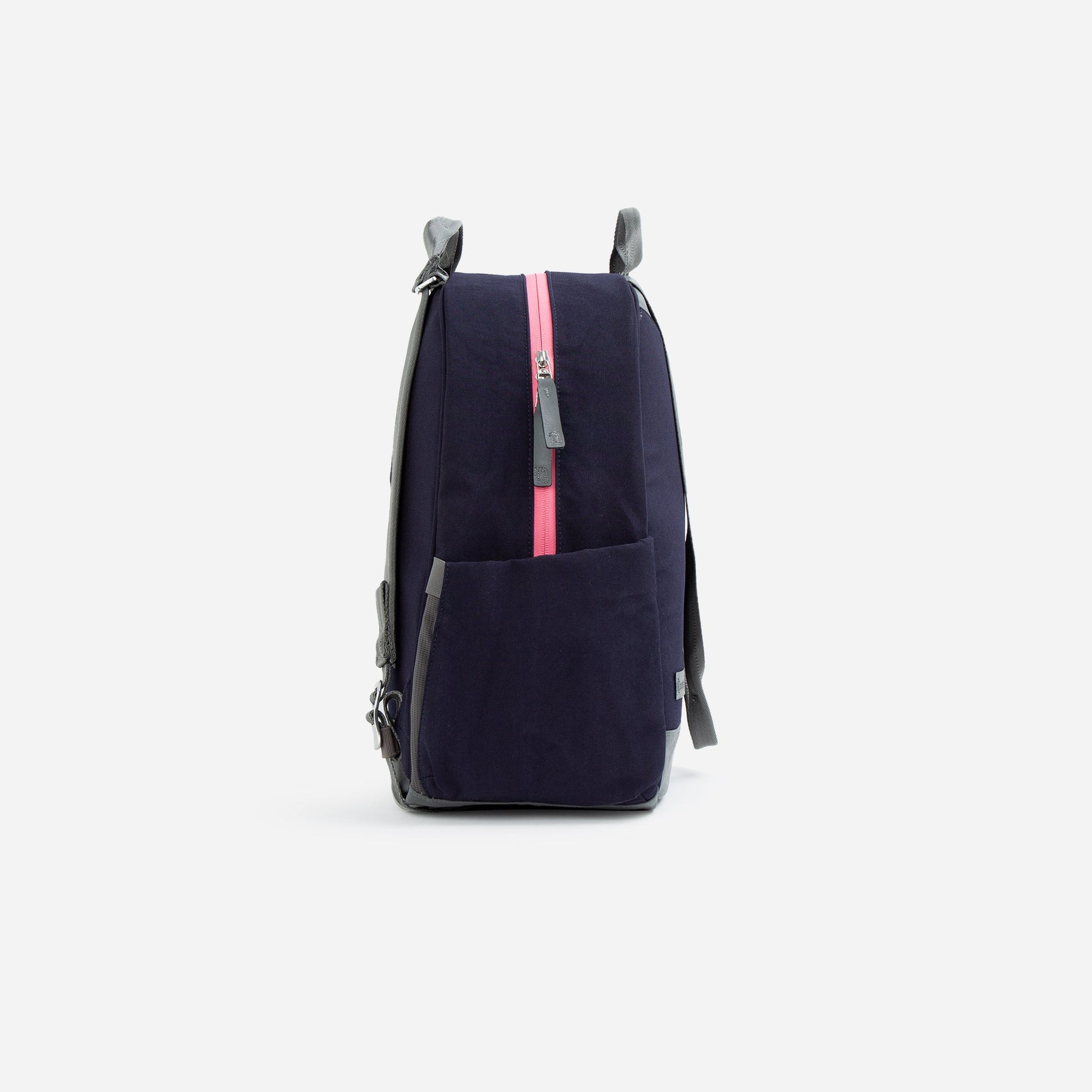 Navy blue  Doubletake tennis backpack with a pink zipper on a white background