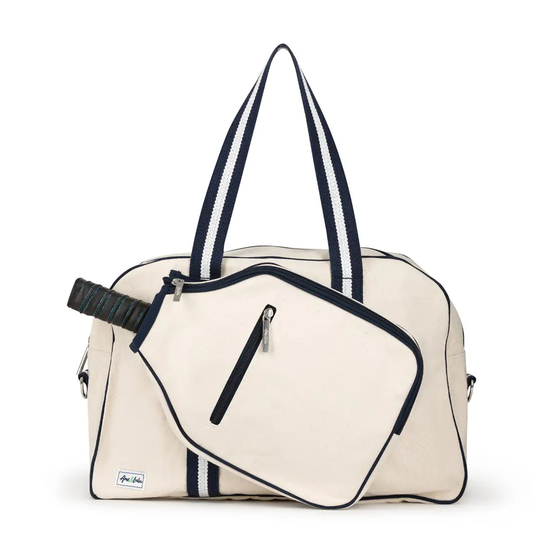 Beige tennis bag with navy accents on a white background