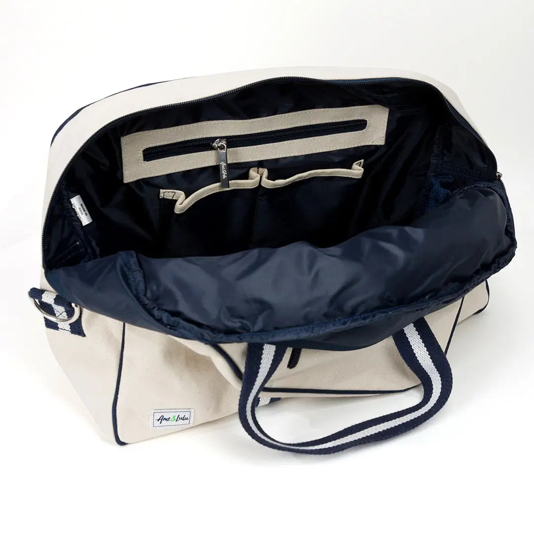 Open bag with navy interior and white exterior on a white background