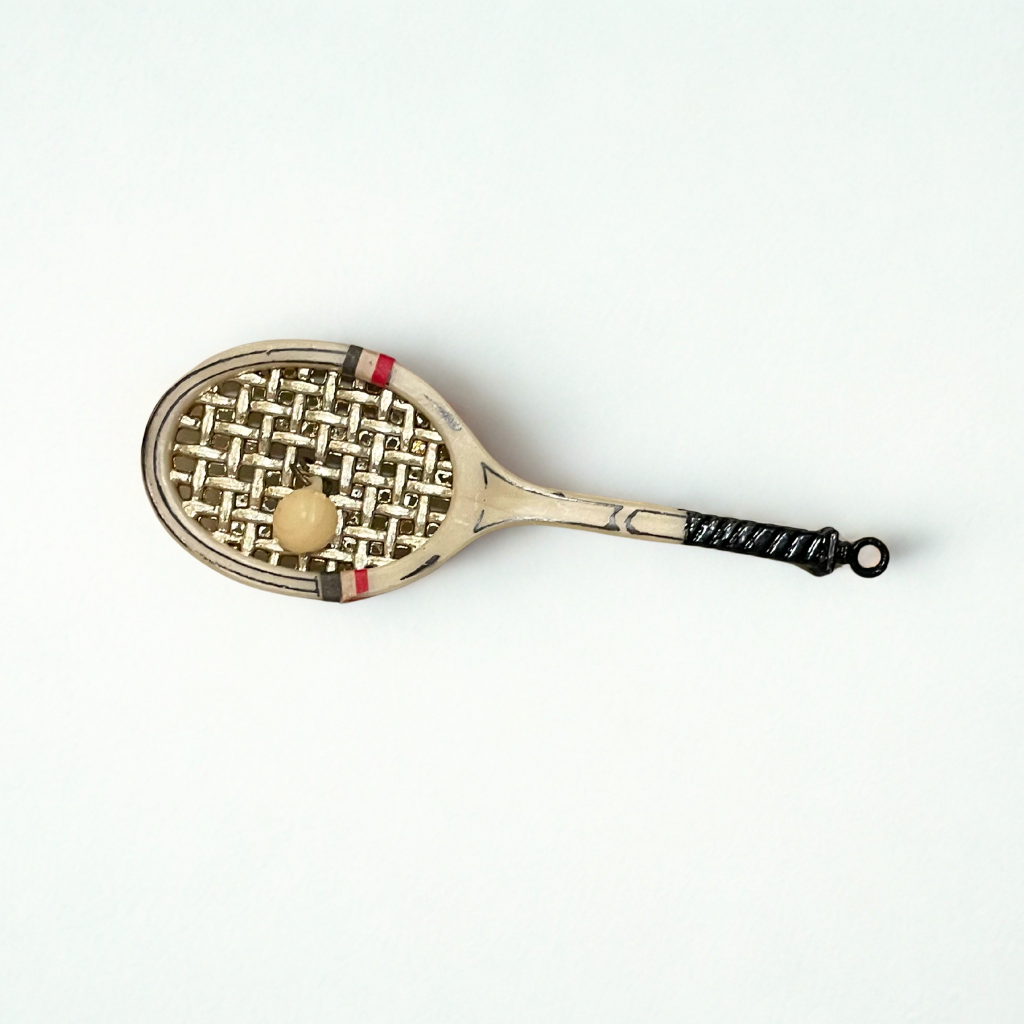 Vintage Annalee Mouse tennis racket ornament from the 1970s featuring a metal racquet, gold-tone strings, and a tiny attached ball.