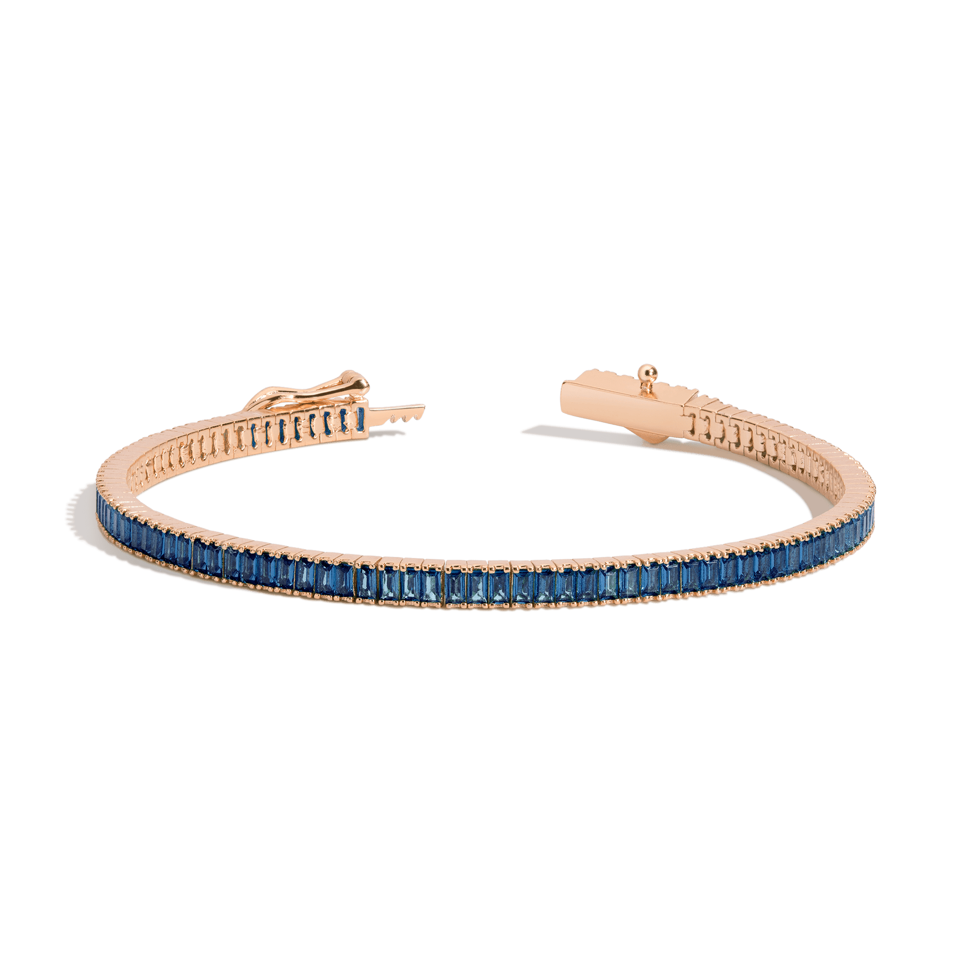 Rose gold bracelet with blue gemstones on a transparent background