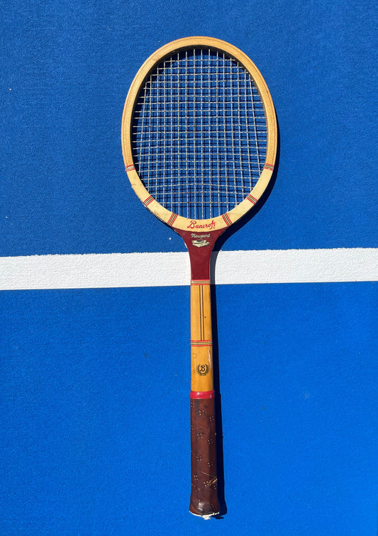 Bancroft Newport Wooden Tennis Racquet on blue tennis court