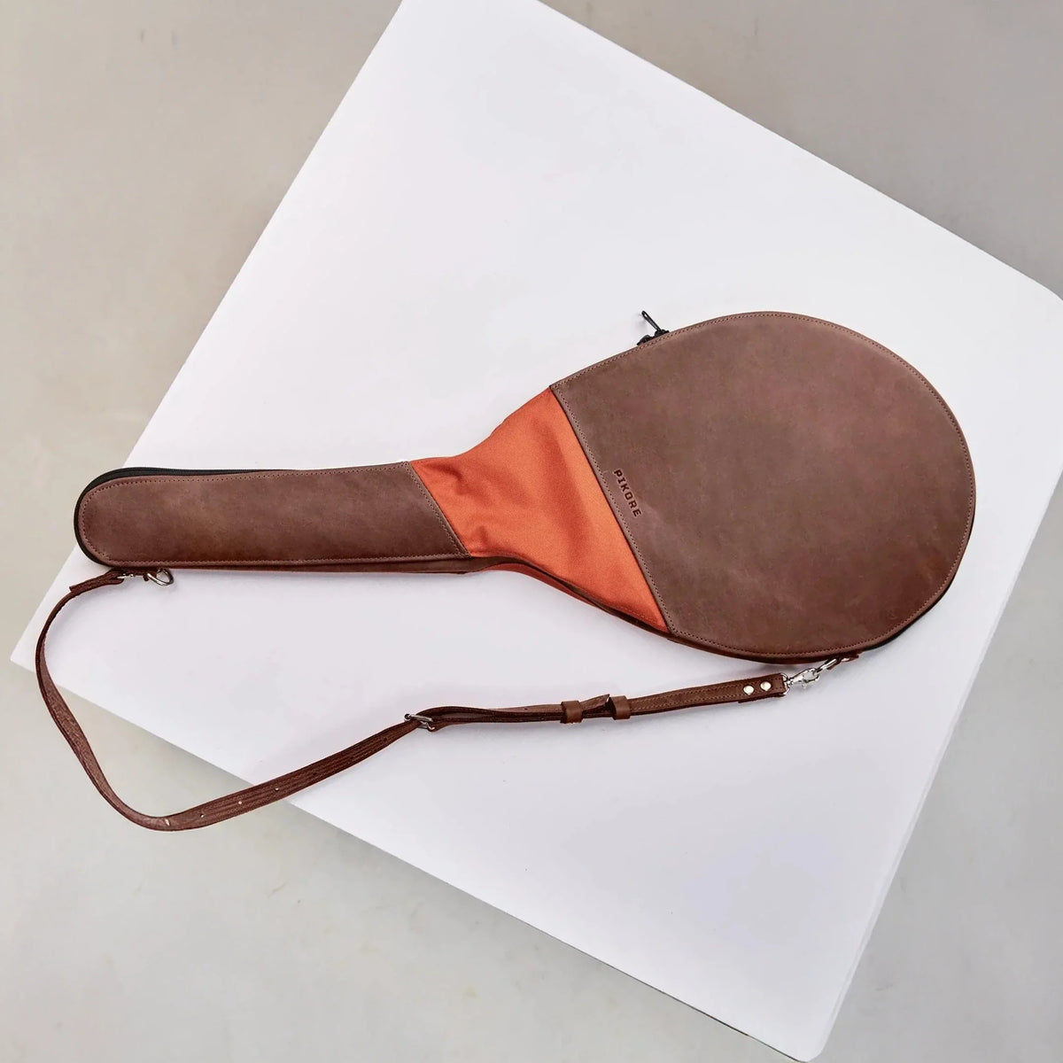 Two tone leather tennis racquet bag.