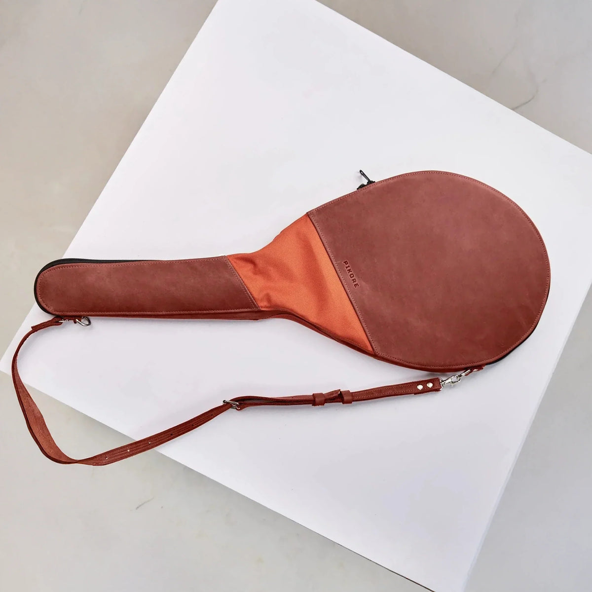 Two tone leather tennis racquet bag.