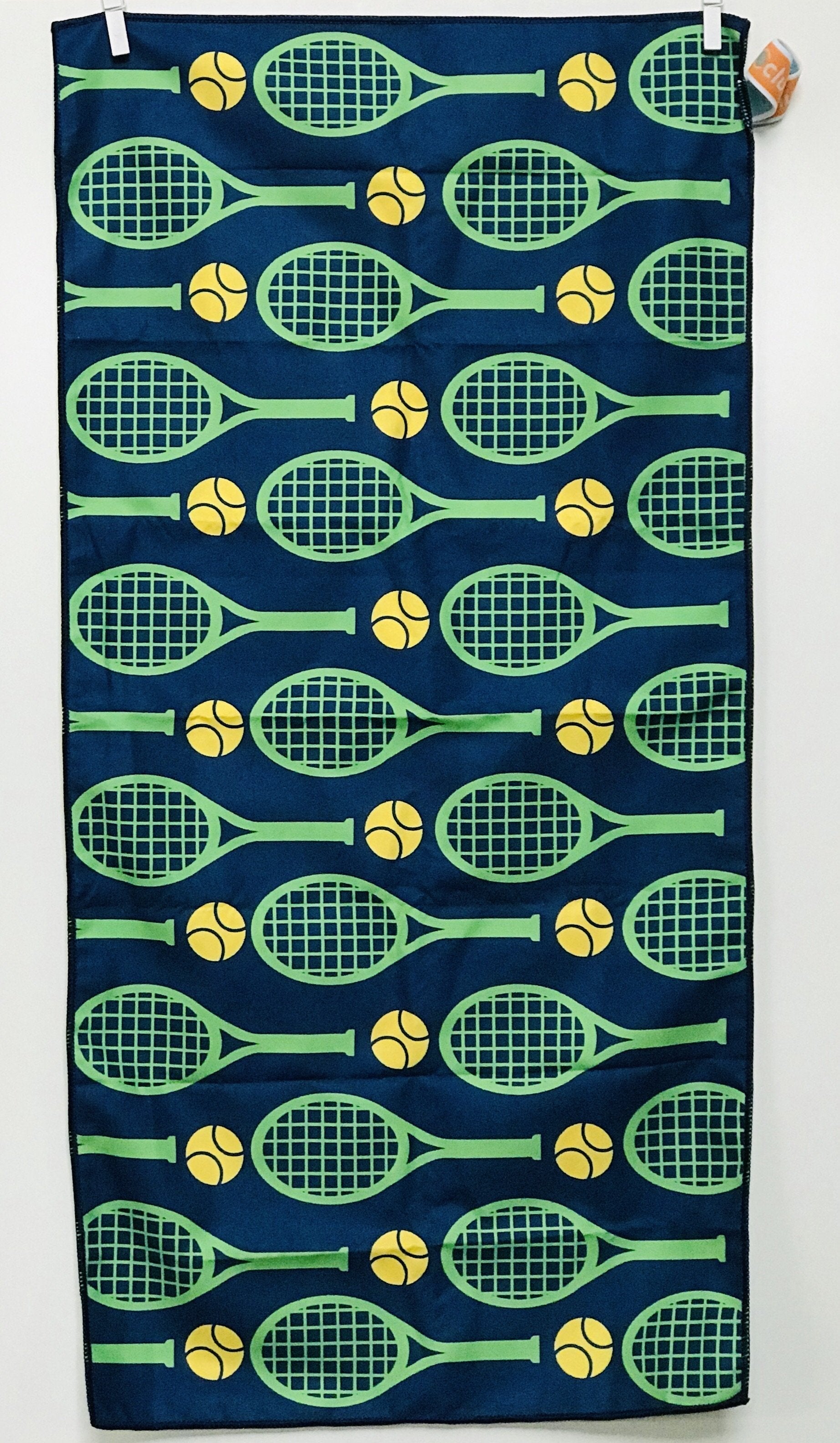 Towel with tennis racket and ball pattern on a blue background