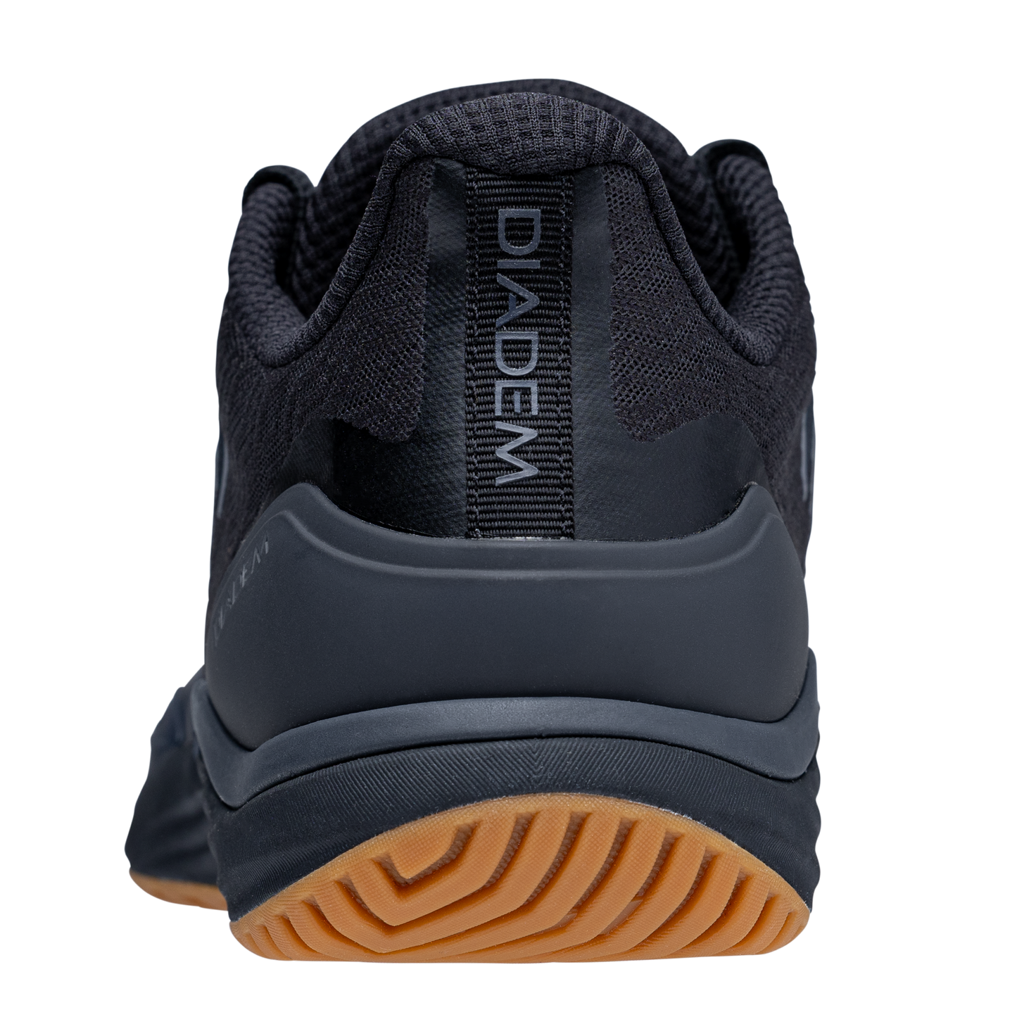 Black athletic shoe with brown sole on a white background