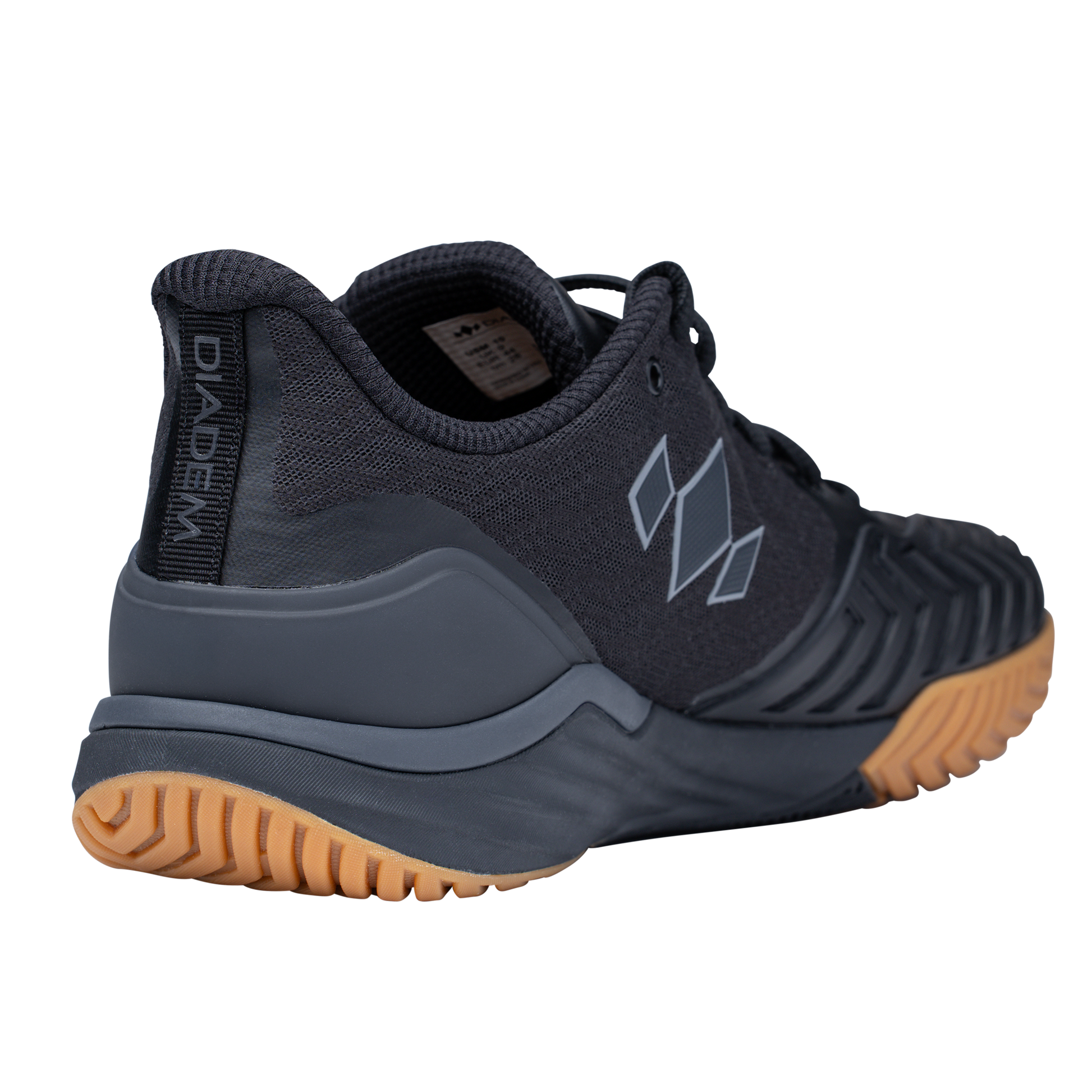 Black athletic shoe with brown sole on a white background