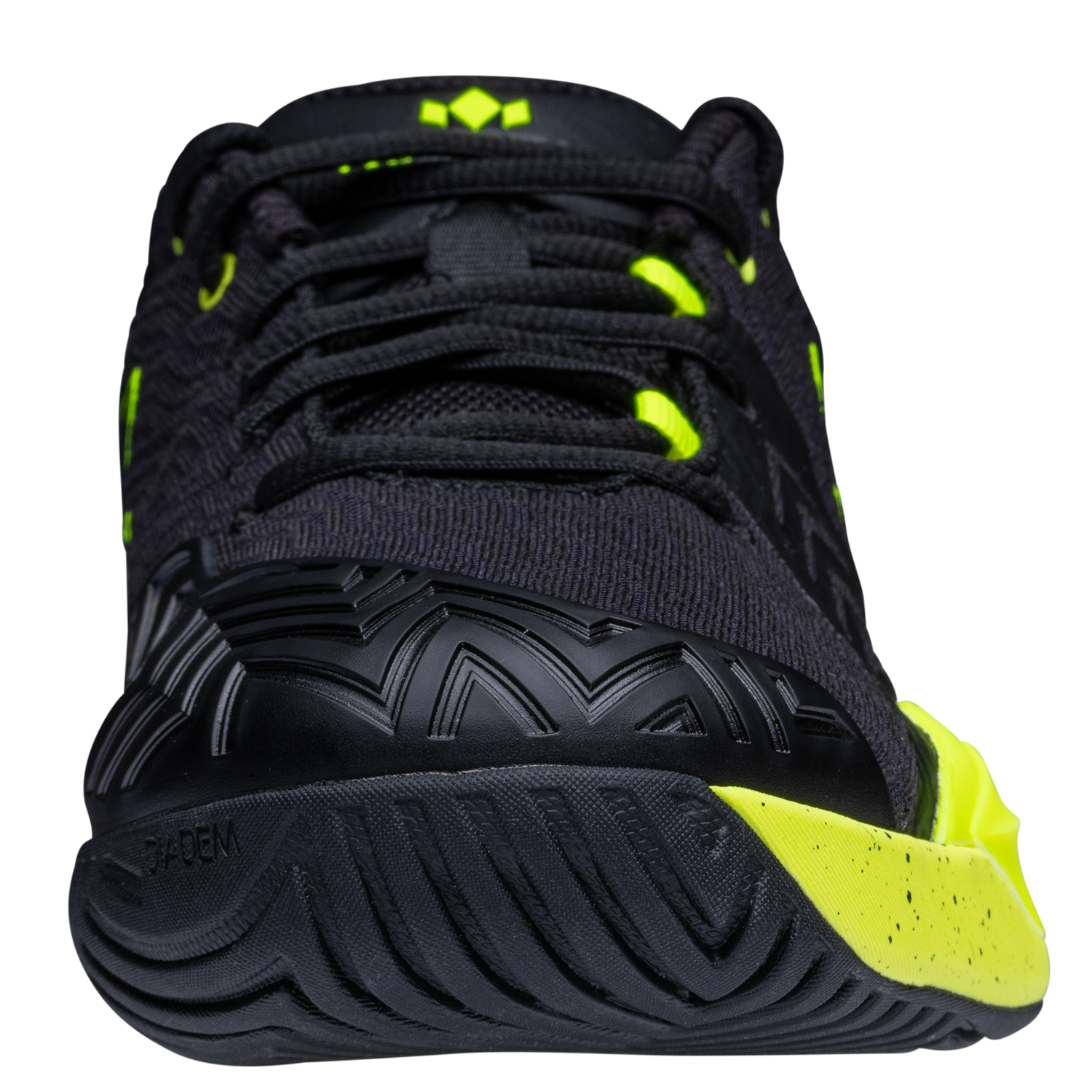 Black and yellow athletic shoe on a white background