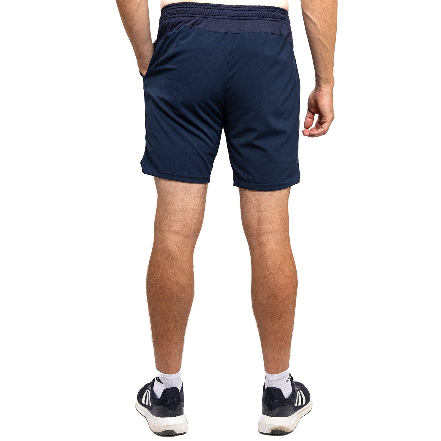 Navy blue shorts worn by a person on a white background