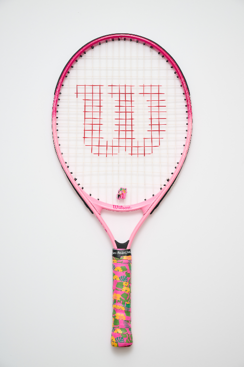 Pink tennis racket with a colorful handle on a white background