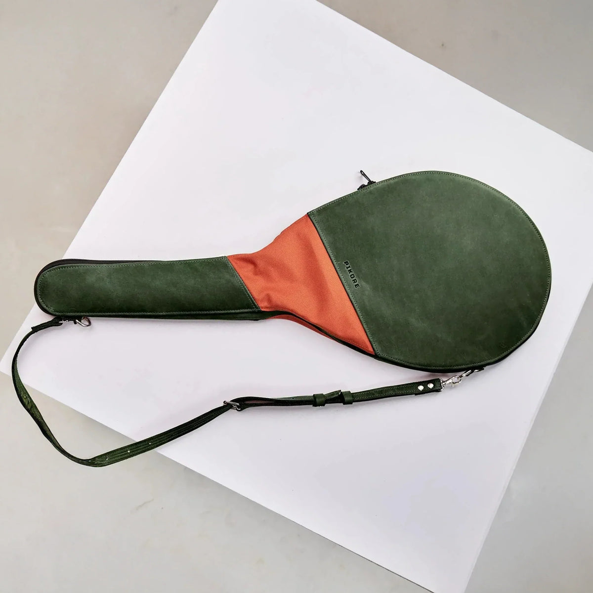 Two tone genuine leather tennis racket cover.