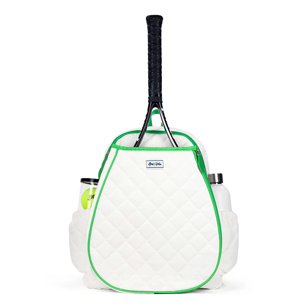 White tennis racket backpack with green trim containing a tennis racket and balls on a white background