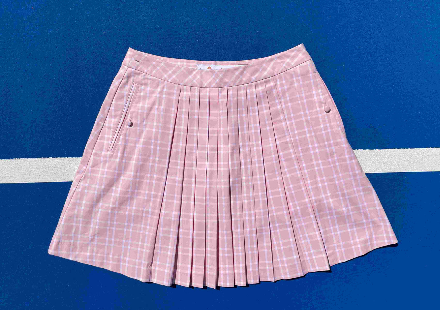 Lily's of Beverly Hills pink plaid skirt on a blue background